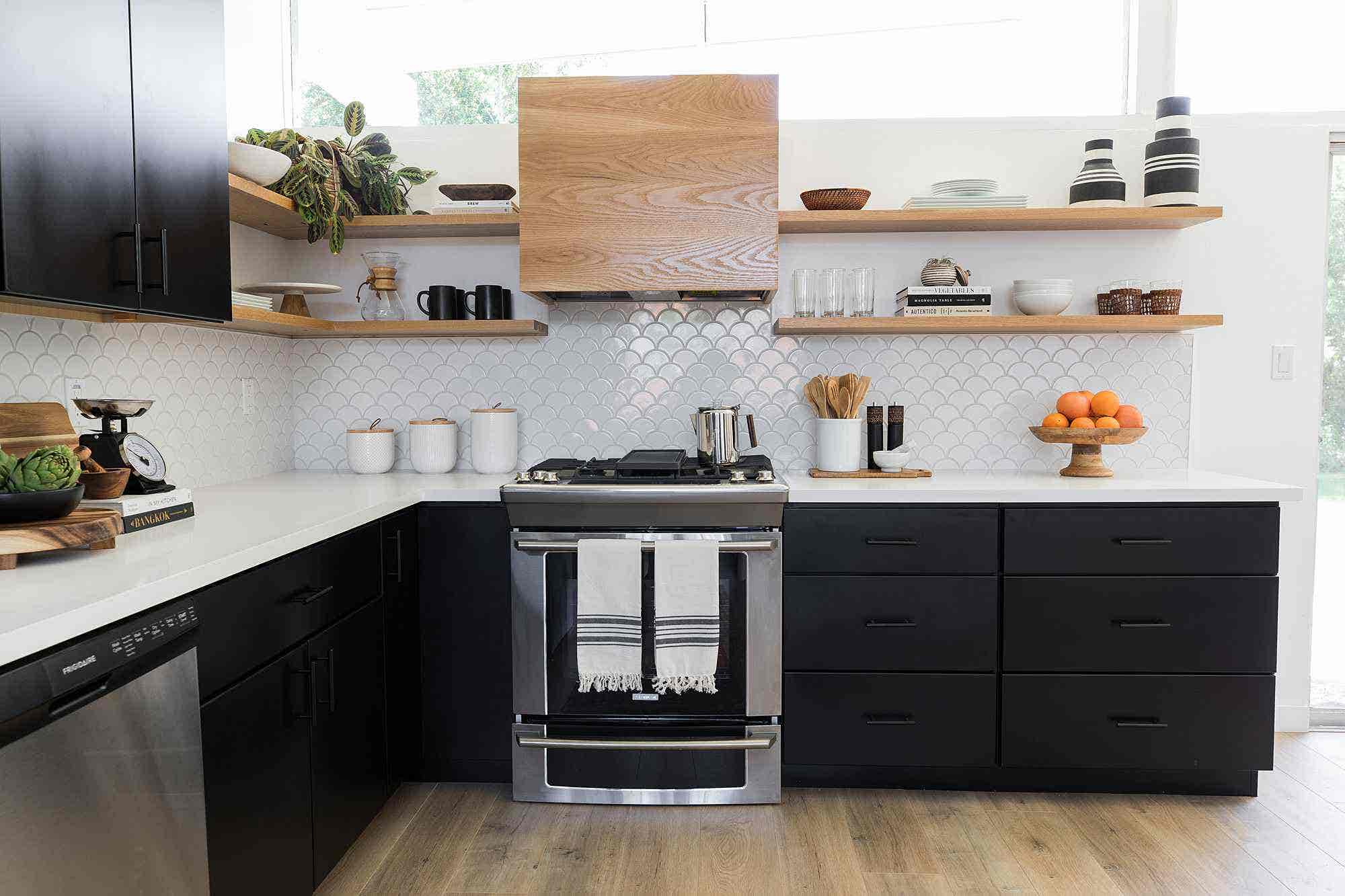 Black hardware on black kitchen cabinets, and white backsplash, open shelves kitchen design