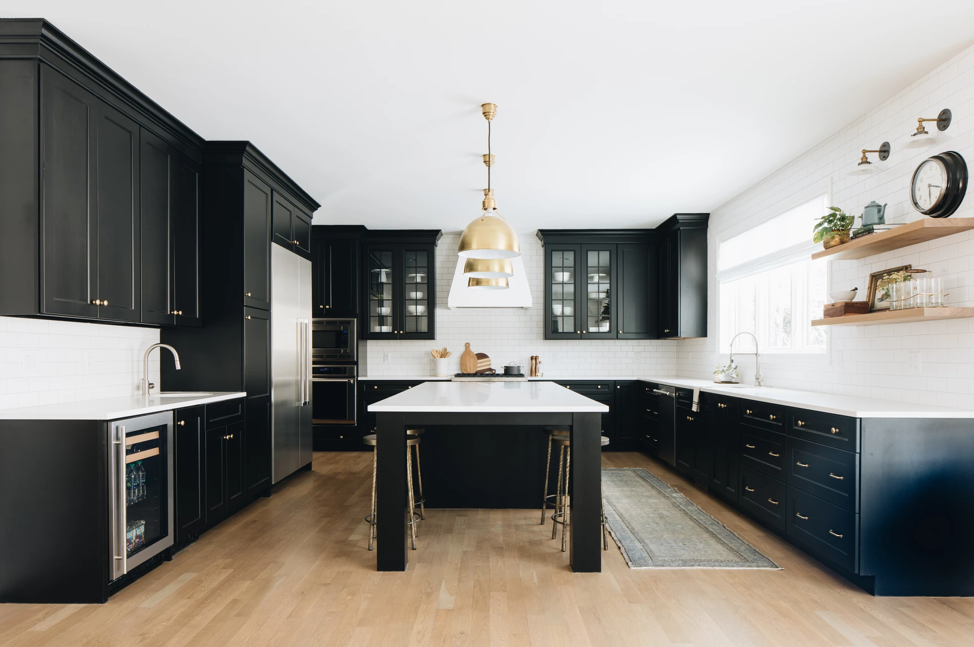 Black kitchen cabinets with deals white quartz countertops