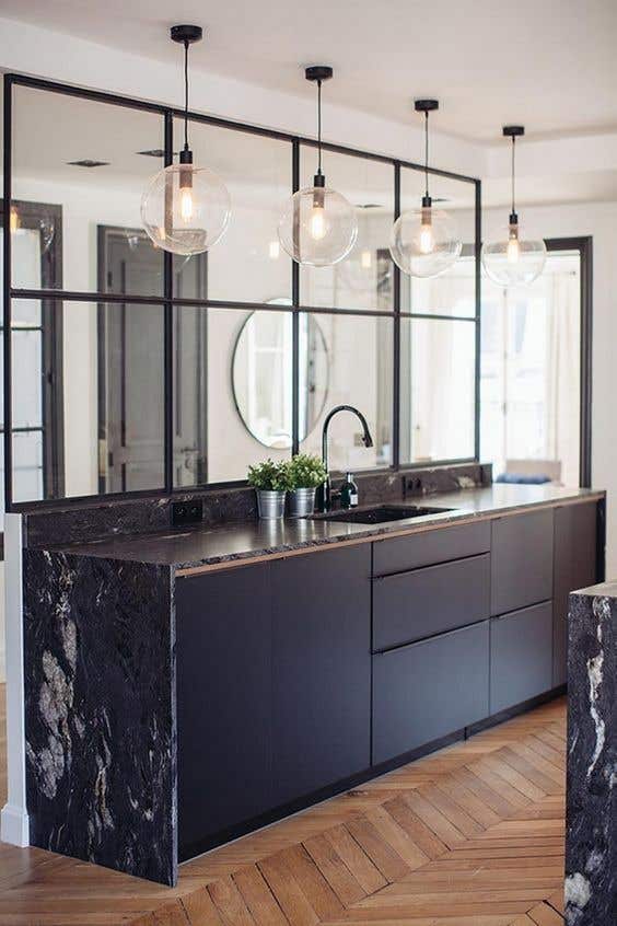 Black and white minimalistic kitchen design with eccentric countertops, fun backsplashes and unique flooring