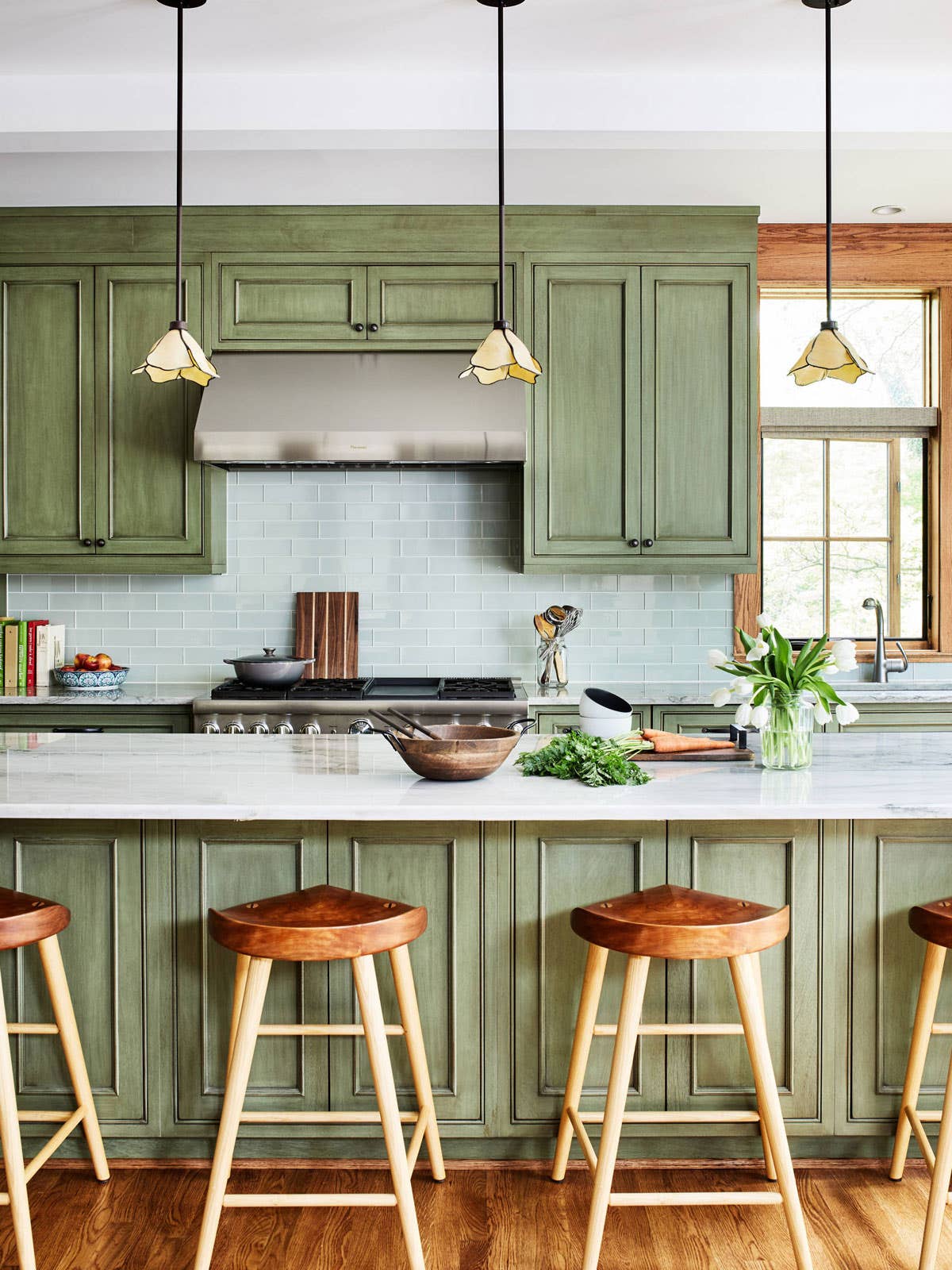 blue backsplash green cabinets