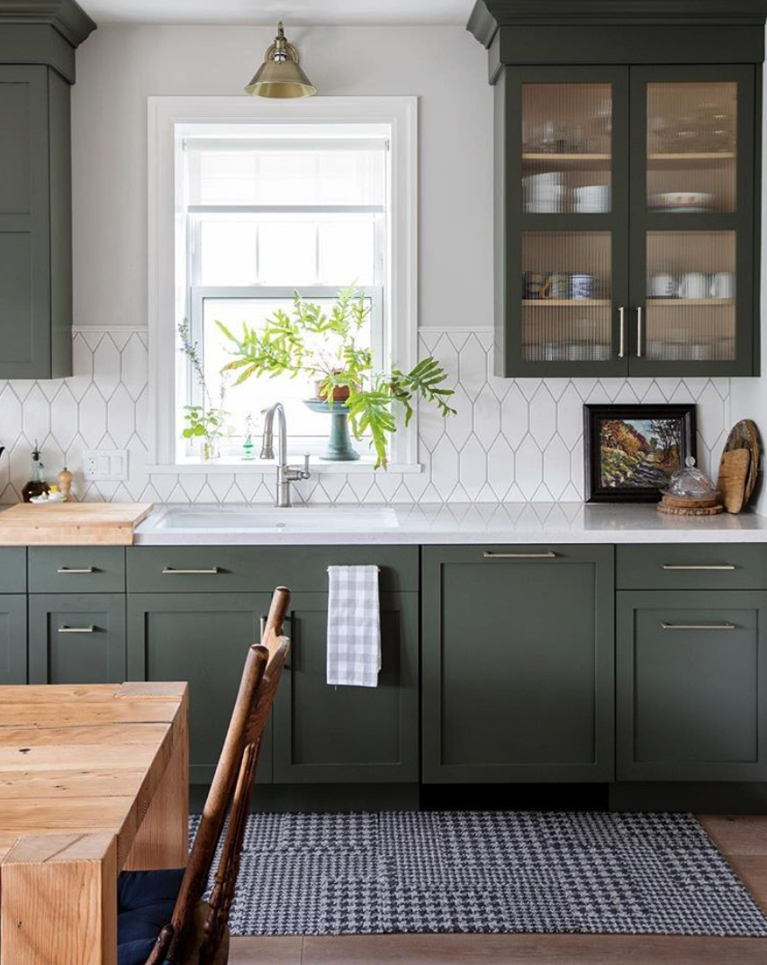 white backsplash green cabinets