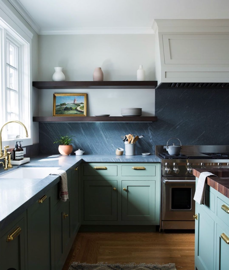 black backsplash green cabinets