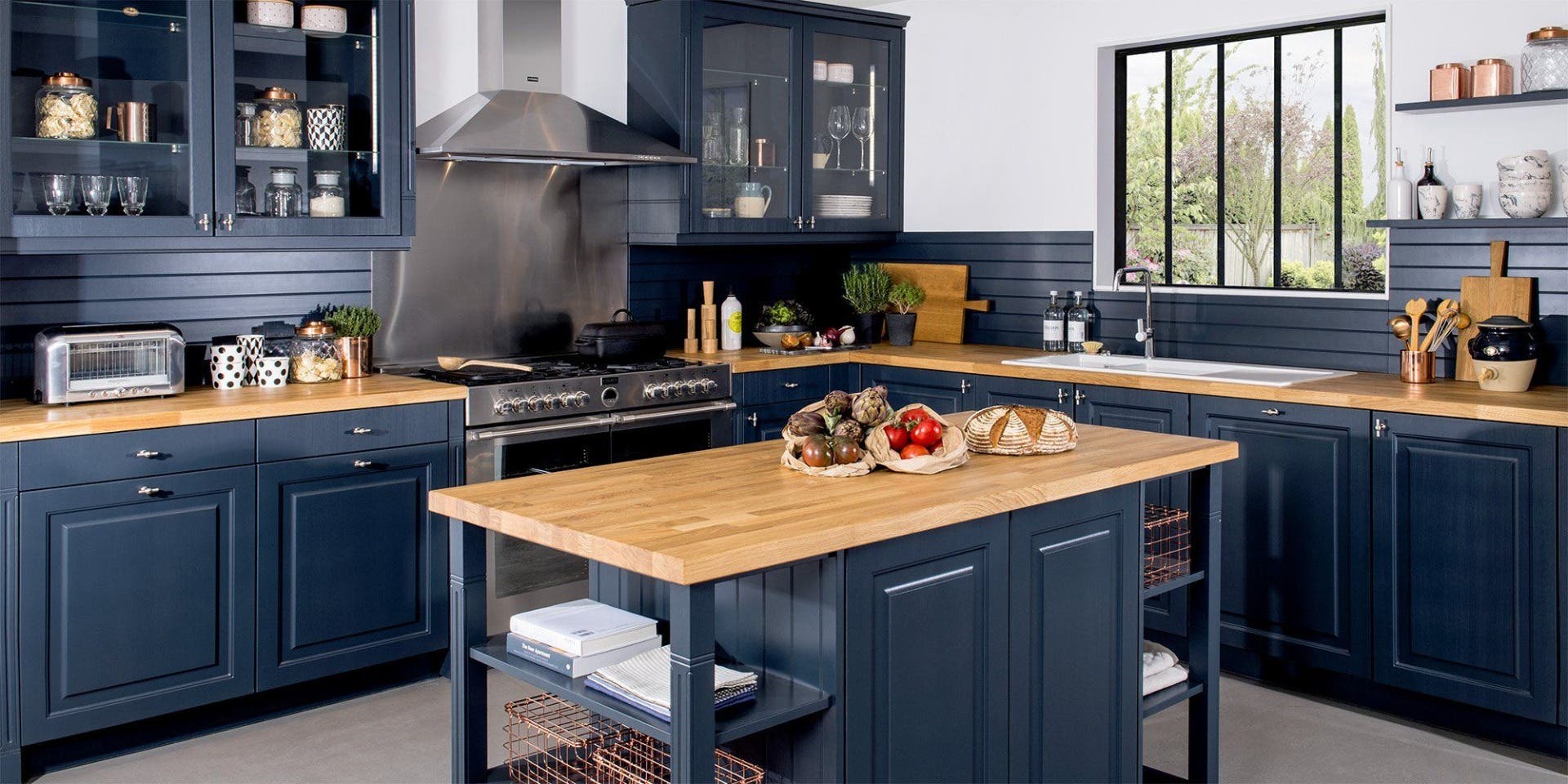 Butcher block countertops with blue cabinets