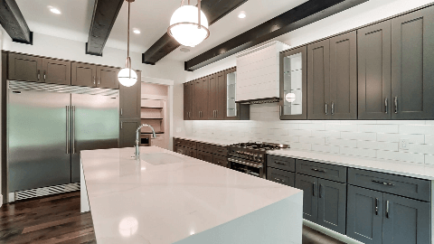 Stylish Kitchen with grey shaker cabinets with large island with under-mount sink