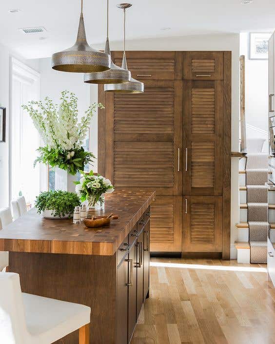 Louvered kitchen cabinet doors paired with Wooden Island 