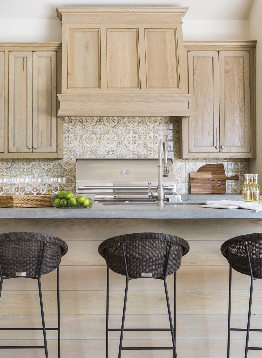 Kitchen with Mantle hood, Pattern tile backsplash and Wood Cabients