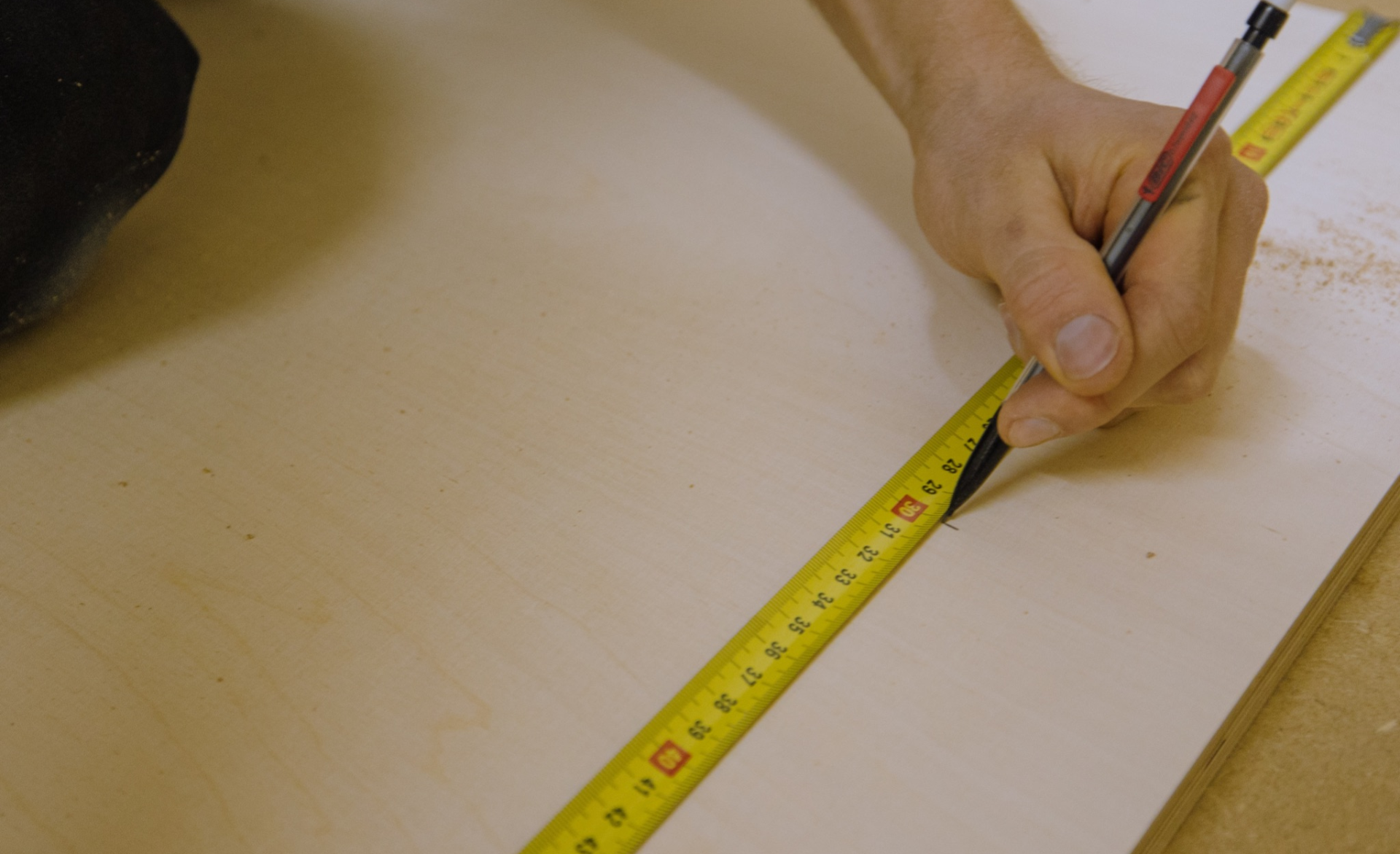 Measuring tape and pen