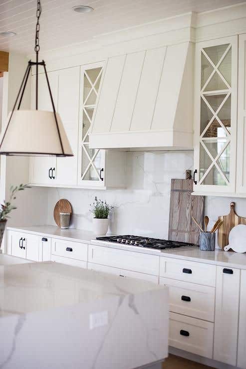 Mullion kitchen cabinet doors paired with black matt knobs, Marble Countertop and Backsplash 