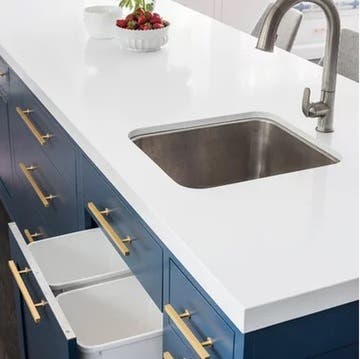 navy blue kitchen cabinets with gold hardware