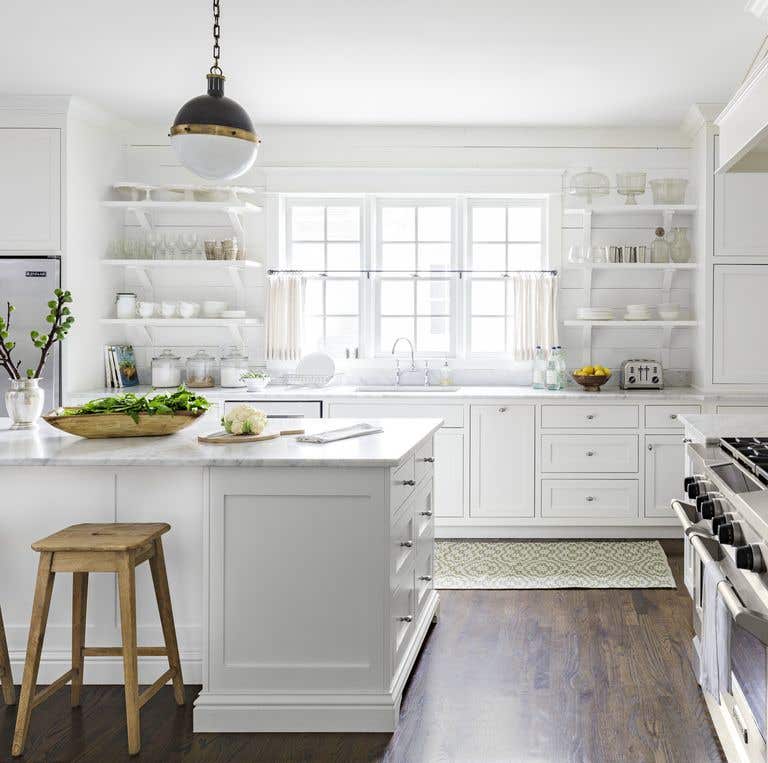 Stunning white kitchen paired with wooden flooring