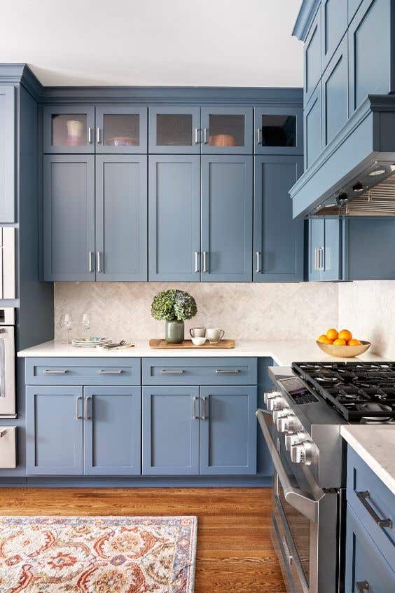 Silver hardware with blue kitchen cabinets