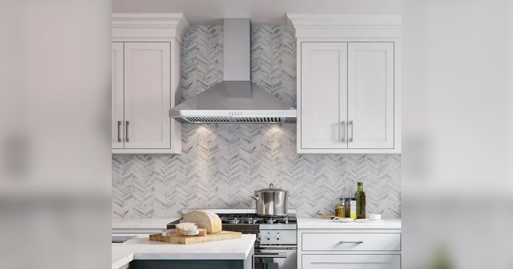 Kitchen with Stainless Steel Hood, Tile backsplash and white cabinets 