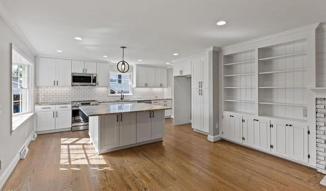 shaker white elite Kitchen cabinets with big white countertop