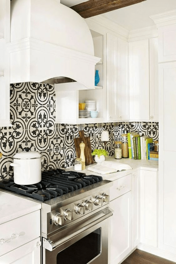 black and white tile backsplash looks like a piece of modern art in this white kitchen design
