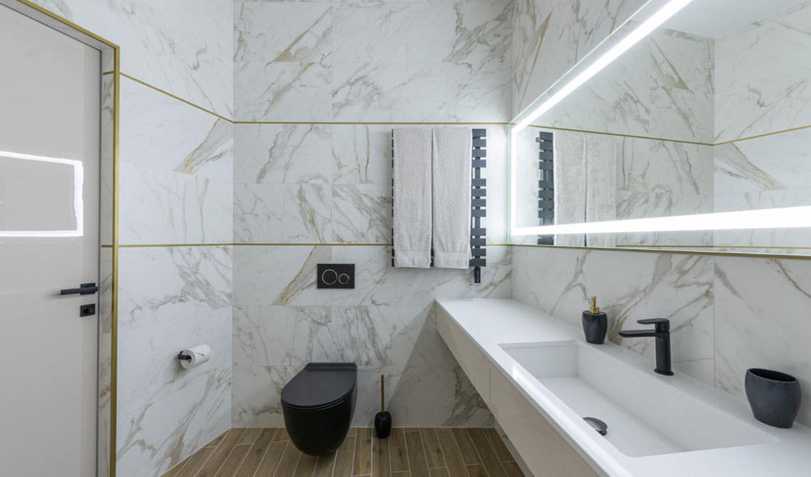 fusion bathroom design with backlit mirrors