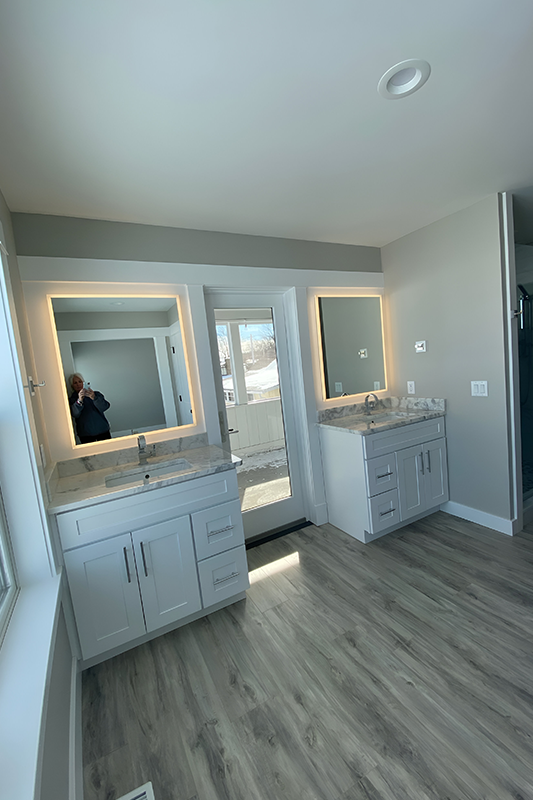 built-in LED lights Mirror paired with white vanity 