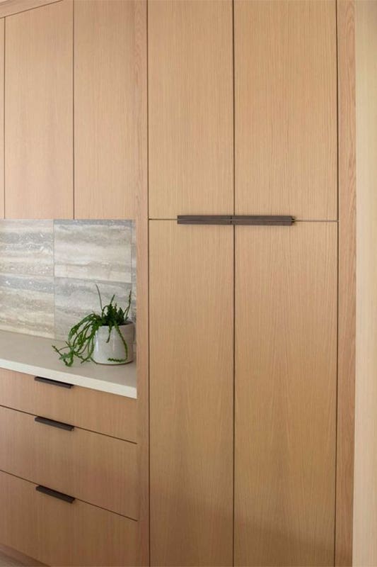 Bamboo kitchen cabinets with white countertop