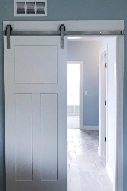 White barn door paired with blue wall