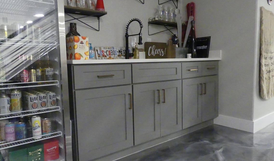 basement family room includes a wet bar