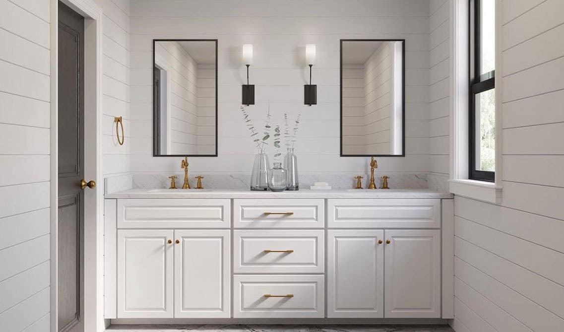 beautiful white bathroom with vanity and gold ahrdware