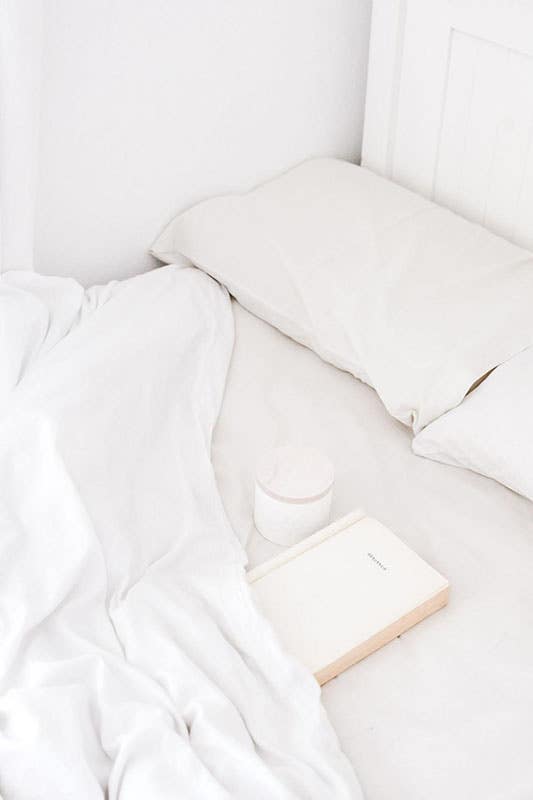 White Mattress and pillow and book