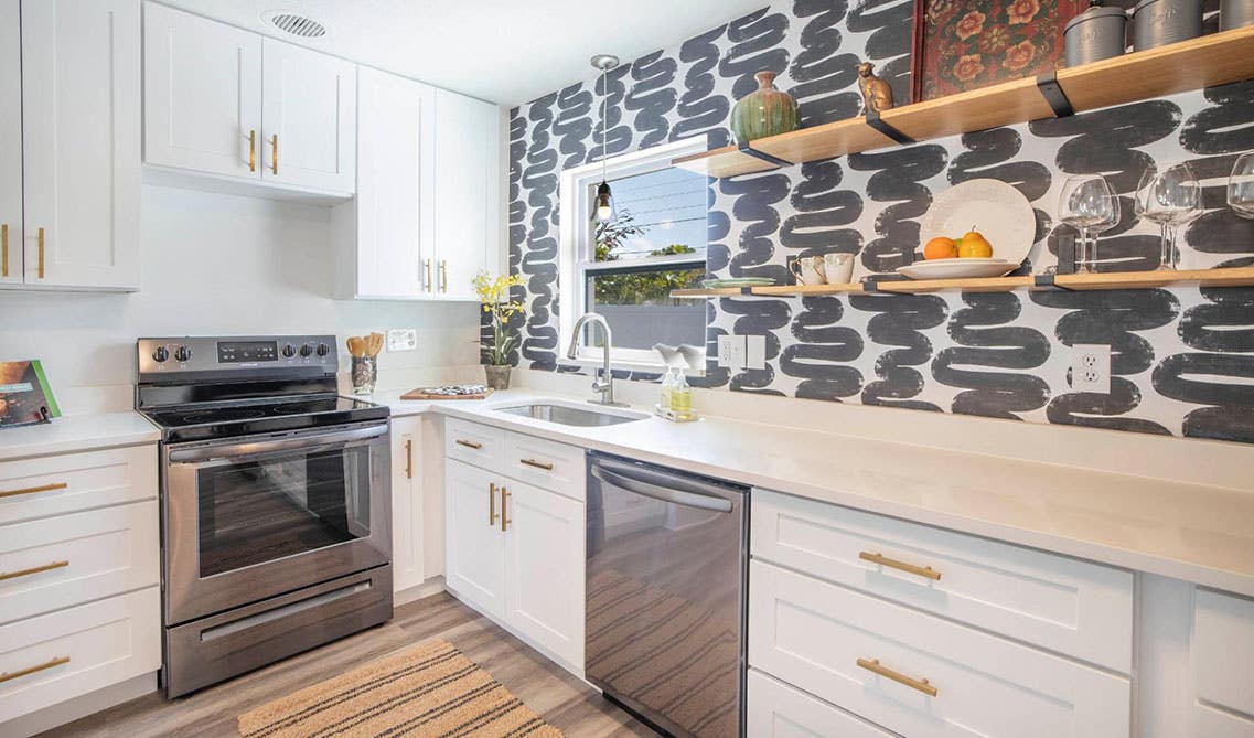 Birch Wood White Cabinets with Gold pulls, Floating Shelves and Accent Wall