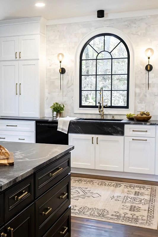 Black and white kitchen design with RTA cabinets, Marble countertop, farmhouse sink and wooden flooring 