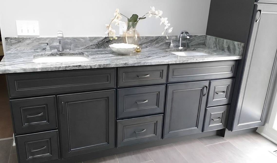 Black bathroom vanity paired with marble countertop