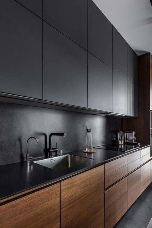 Black contemporary kitchen with wood kitchen cabinets