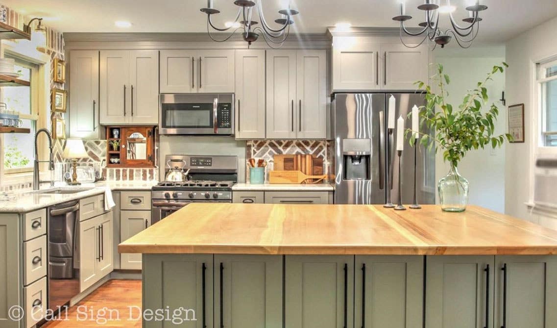 Rustic style kitchen with gray shaker cabinets and brick style backsplash 