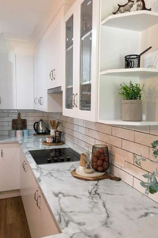 Glossy Brick Backsplash with Marble countertop