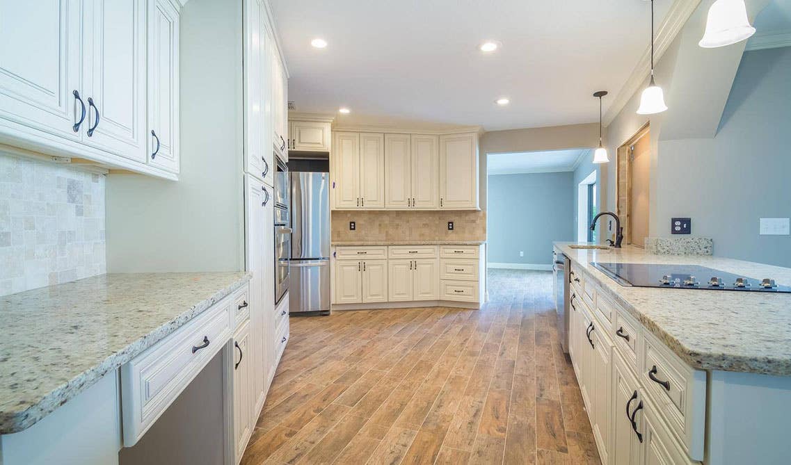 Bristol Linen Kitchen Cabinets Paired with Quartz Countertop and Tile Backsplash