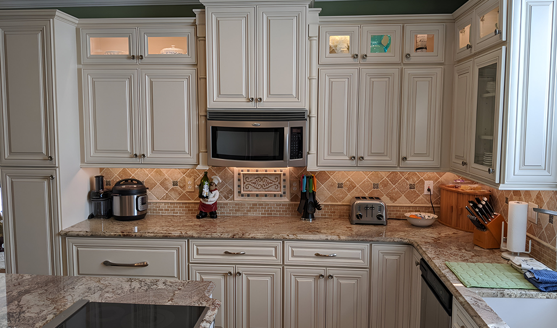 Bristol linen kitchen cabinets with brass hardware
