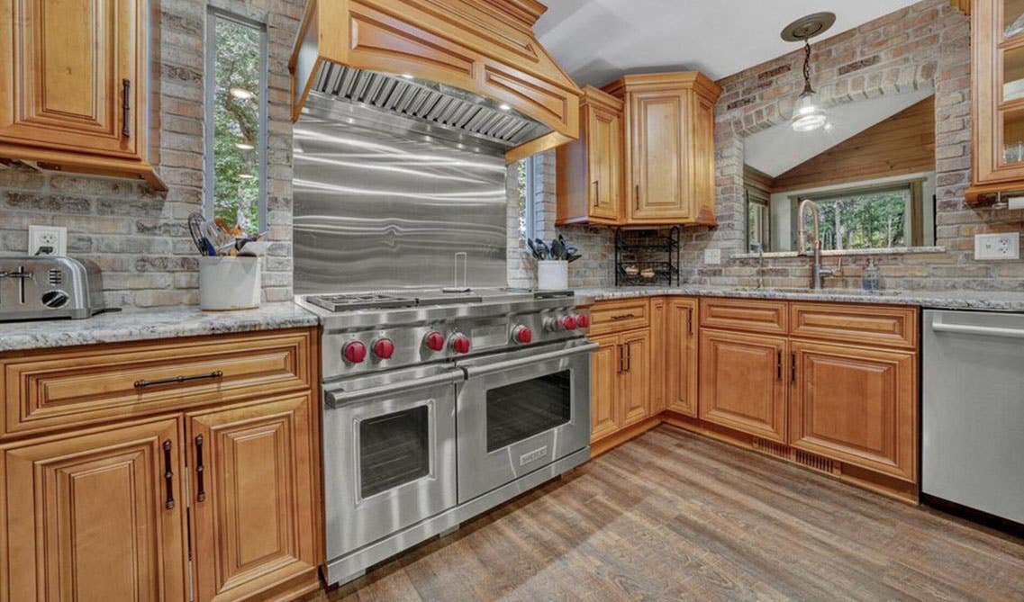 Kitchen design with Brown Brick Walls With Brown Cabinets