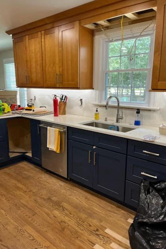 Kitchen design with Brown and Navy Blue Cabinets, white countertop
