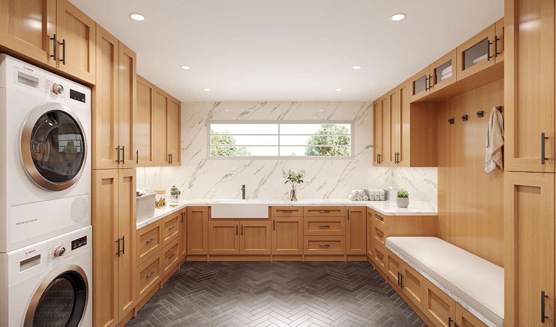 laundry room with accessibility like dark cabinets, sitting bench, washer and dryer, and hooks