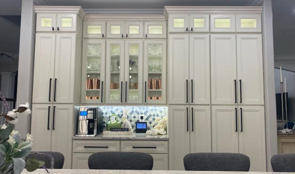 Galley kitchen with Glass cabinet doors with black hardware