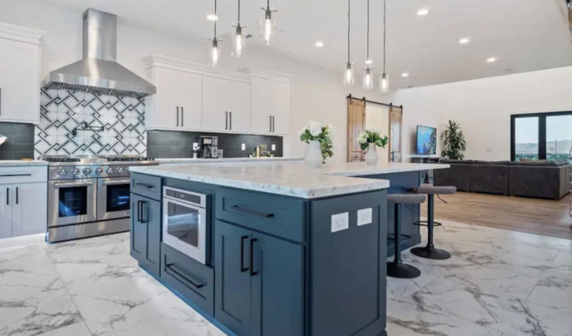 Kitchen Island Cabinets with marble countertop, and marble flooring