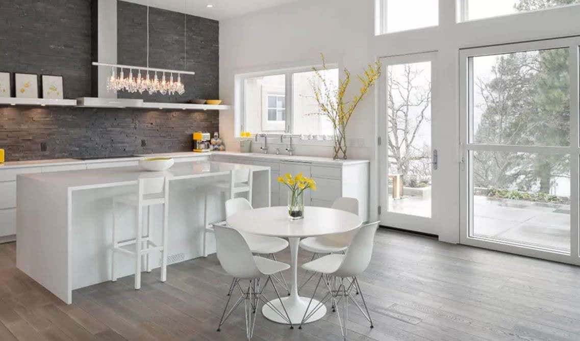 white cabinets with a dramatic charcoal grey stacked stone backsplash