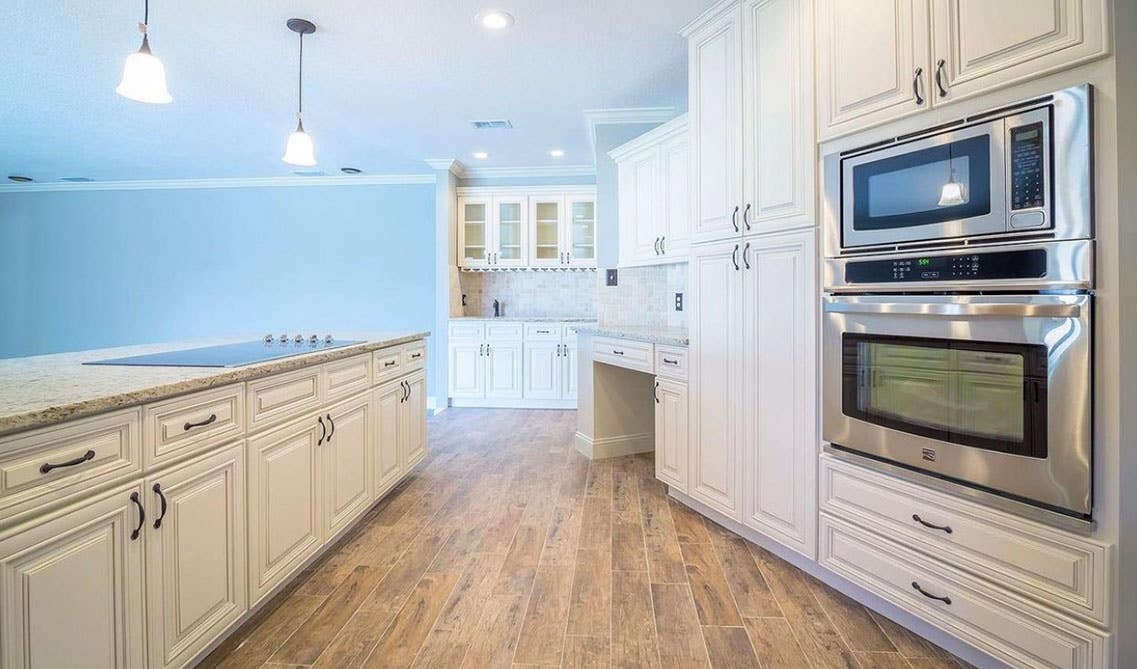 Linen Cabinets with stainless steel appliances 