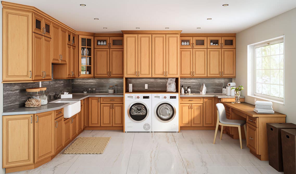 Laundry Room with wood cabinets, marble countertop, washer and dryer, marble flooring and tile backsplash