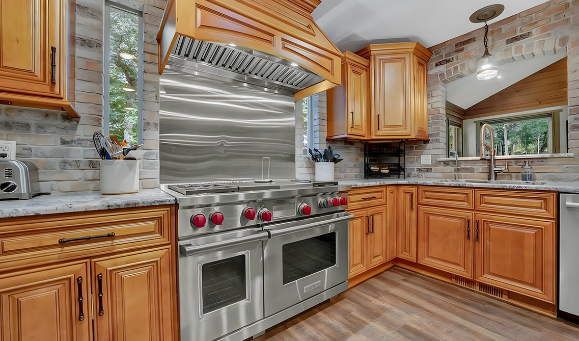 Charleston Toffee cabinets paired with stainless steel appliances 
