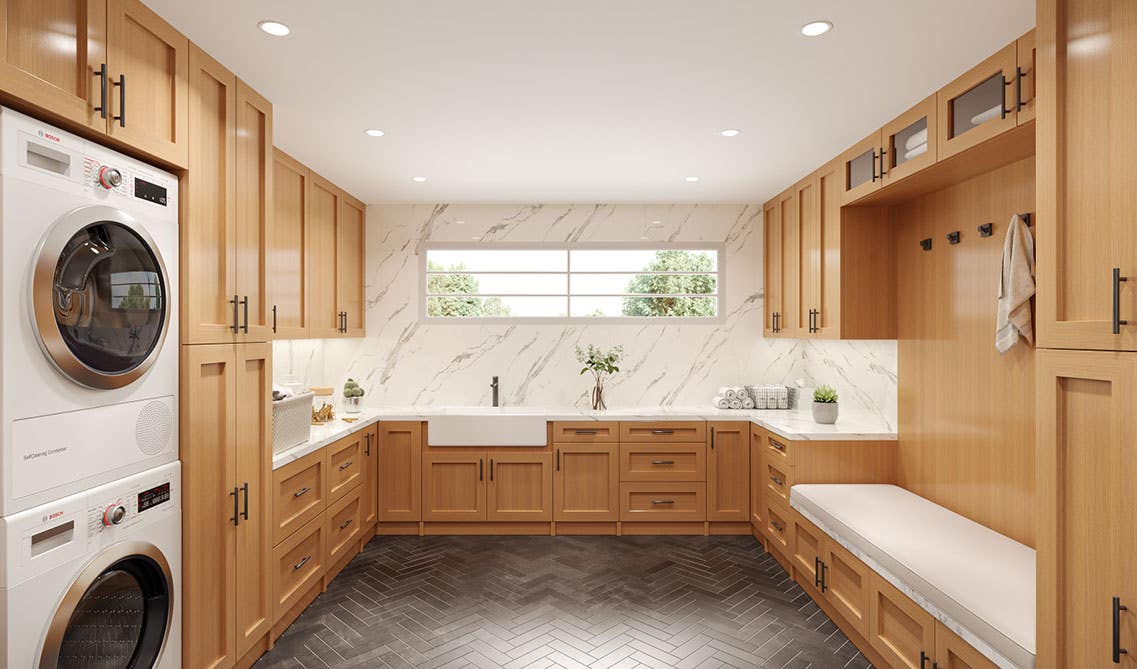 Laundry Room with Cinnamon Shaker Cabinets, washer and dryer, built-in seating area and marble countertop