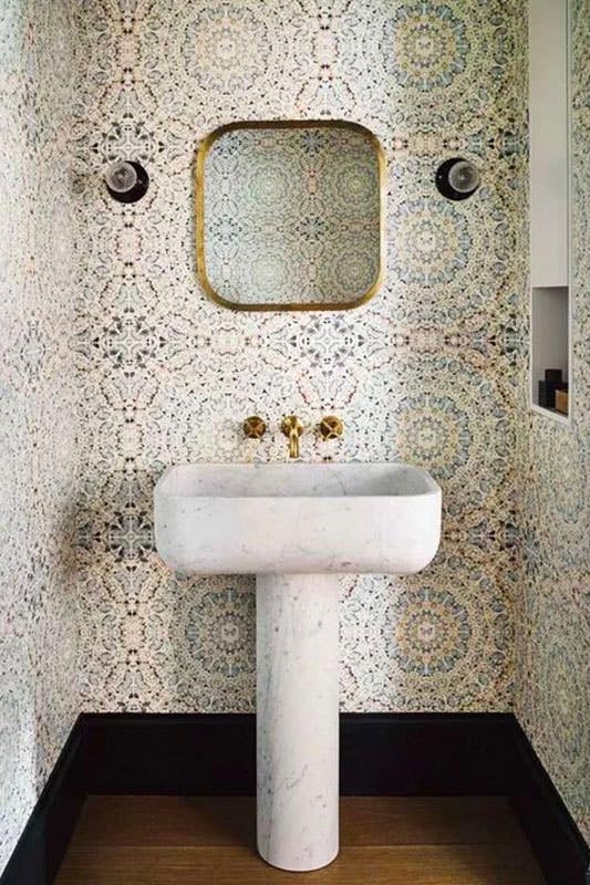 Classic white sink with bold wallpaper 