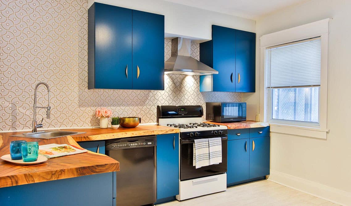 Coastal-inspired Kitchens with navy blue cabinets