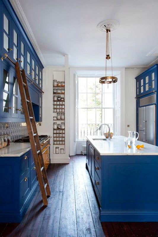 Cobalt blue kitchen cabinets with white countertops