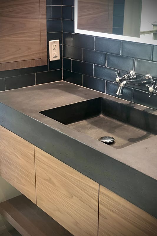 wood bathroom vanity with concrete countertops