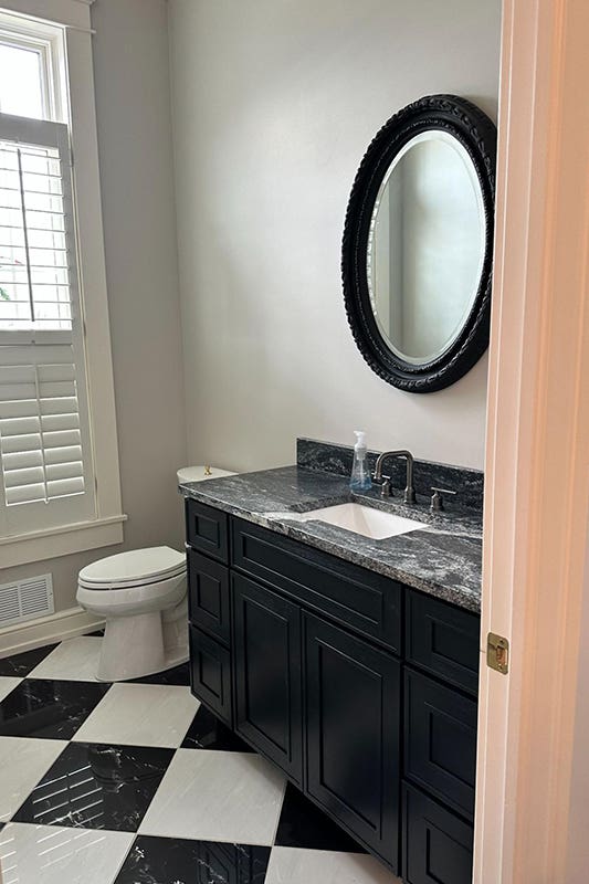 Craftsman Black Shaker Vanity paired with marble countertop