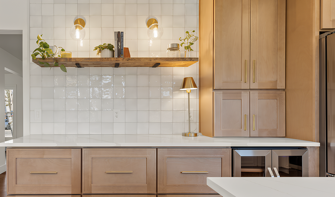 Brown tone kitchen cabinets paired with white subway tiles backsplash and floating shelve 