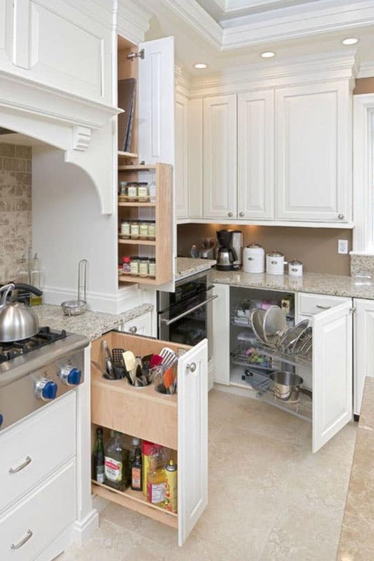 Kitchen design with custom cabinets like pull out drawer and lazy Suzan cabinets